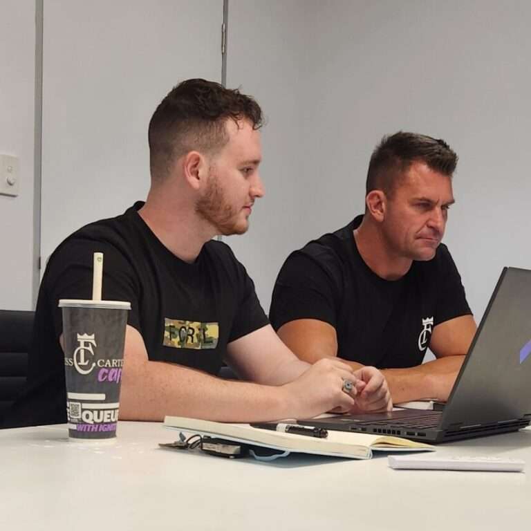 Jakob, owner of Unreal Media sitting with his client Nathan James, Owner of Fitness Cartel Australia planning out content and putting together a strategy for Fitness Cartel marketing.